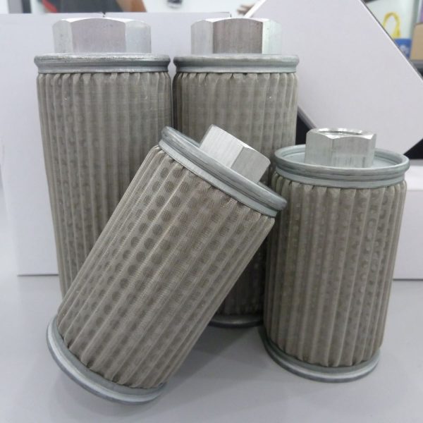 Image of MF Filter, four filter cartridges of varying sizes displayed neatly on a table.