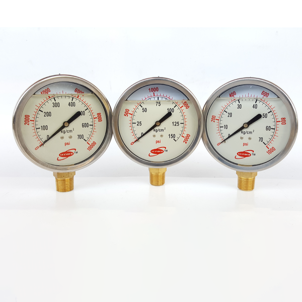 Three pressure gauges on a white surface, use to measure different levels of pressure.