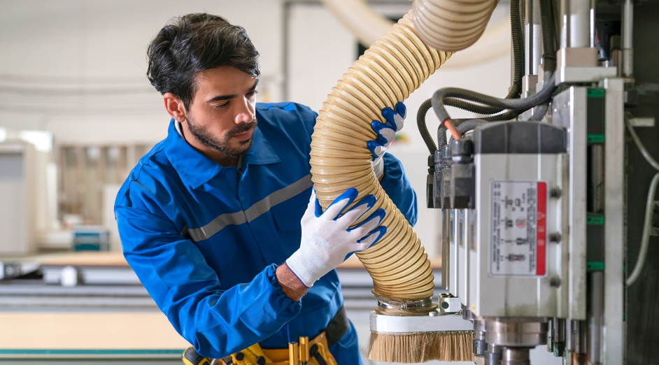 A man checking the ducting hose durability